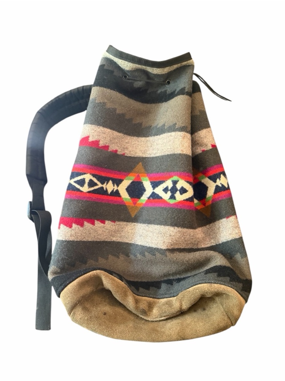 Vintage Pendleton wool barrel backpack with geometric pattern and suede base.